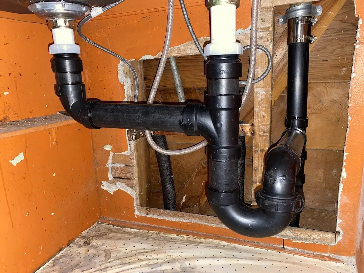 Professional Garbage Disposal Repair equipment and tools on the job in Swanton